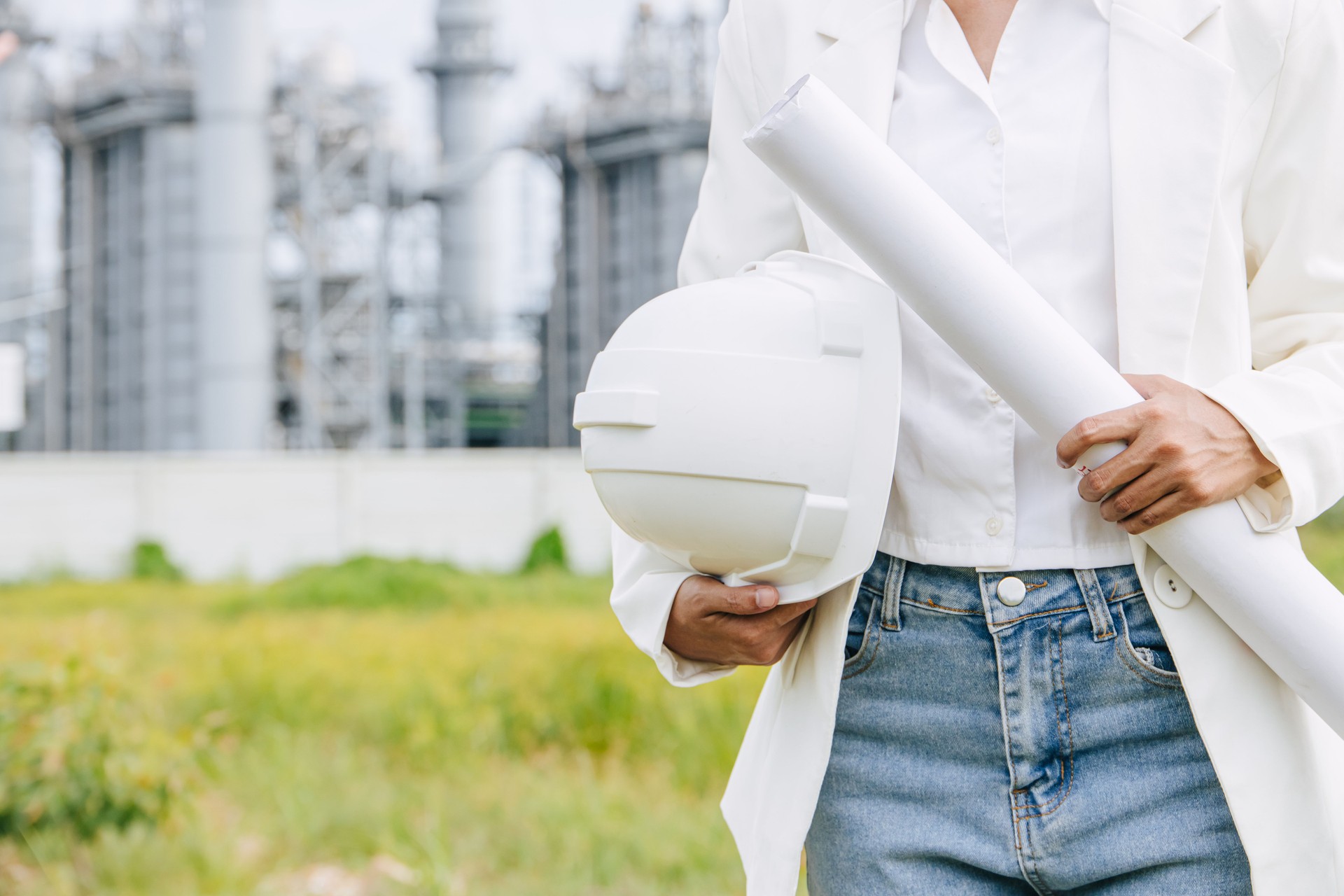 Professional Engineer Female Working Standing Against Oil Gas Refinery Industry Building Closeup Hand Holding Hard Hat.